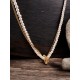 Collier double rang en acier doré et perles