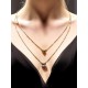 Collier double rang en acier doré et perles